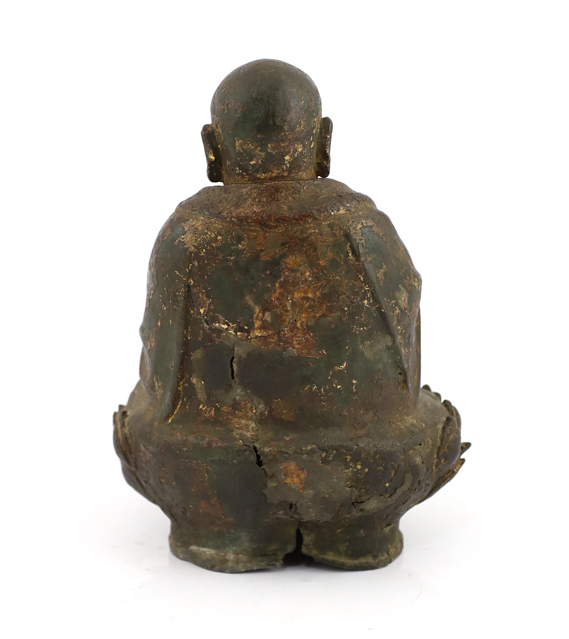 A Chinese lacquered bronze figure of Budai, late Ming dynasty, cracks and old repairs